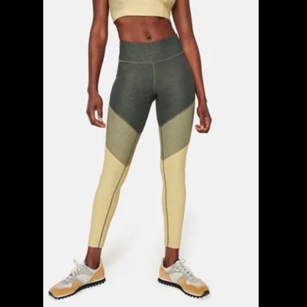 Outdoor Voices dark green and yellow color block compression leggings